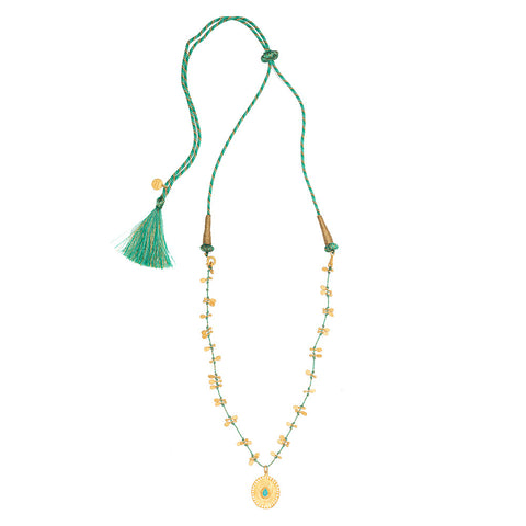Turquoise pendant on green silk string